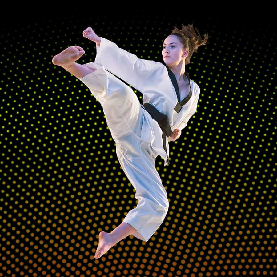 Martial Arts Lessons for Adults in Chino Hills CA - Girl Black Belt Jumping High Kick