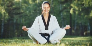 Martial Arts Lessons for Adults in Chino Hills CA - Happy Woman Meditated Sitting Background